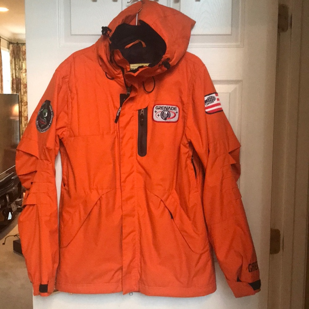 Men’s orange Grande Ski jacket. Size small.